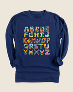 A long sleeve navy blue t-shirt with the alphabet in multicolor letters, each paired with an illustration of an accessibility tool or item.