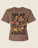 Brown t-shirt with colorful floral design and text 'Find Joy In Connection' on a beige background