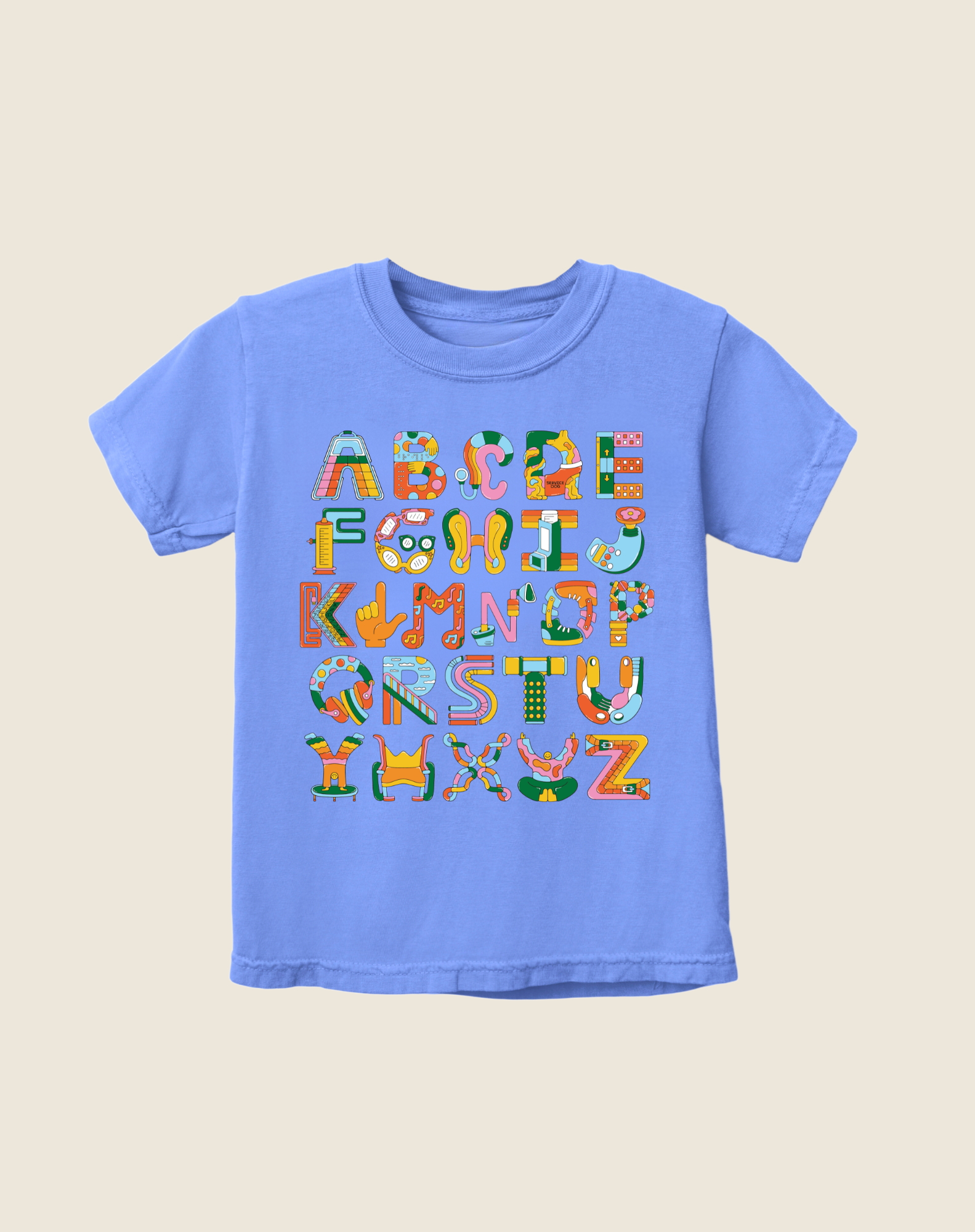 A blue kid's t-shirt with a colorful alphabet design featuring various assistive tools and technologies.