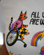 T-shirt with a tiger riding a unicycle, rainbow, and text on a white background