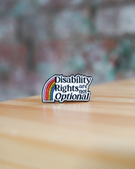 Pin with 'Disability Rights are not Optional' text on a blurred background