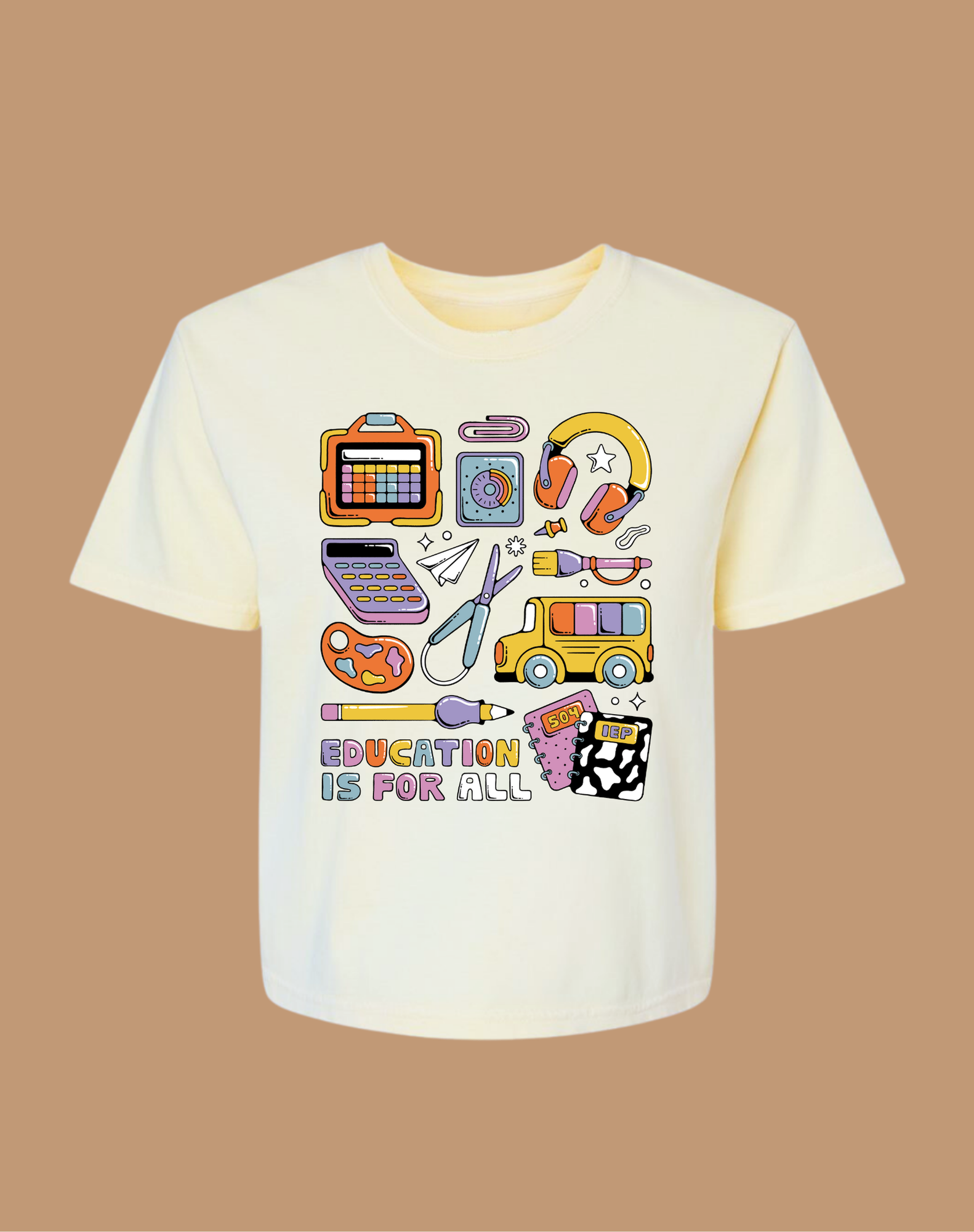 White t-shirt with educational-themed graphics on a brown background
