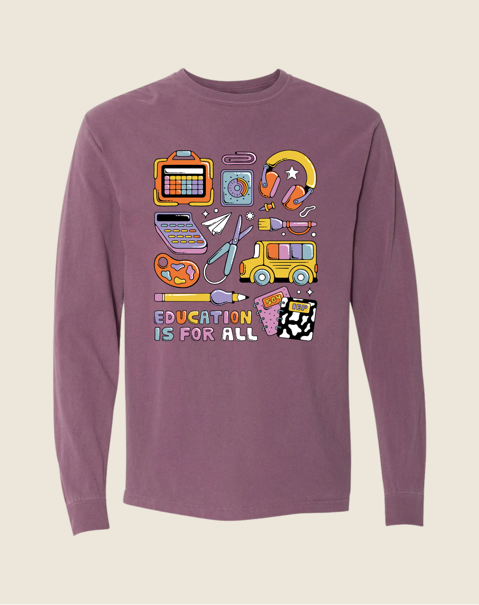 Purple long-sleeve shirt with educational-themed graphics on a beige background