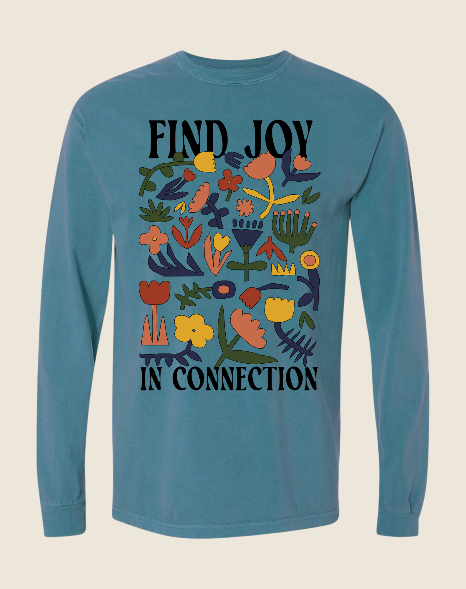 Blue long-sleeve shirt with floral design and text 'Find Joy In Connection' on a beige background