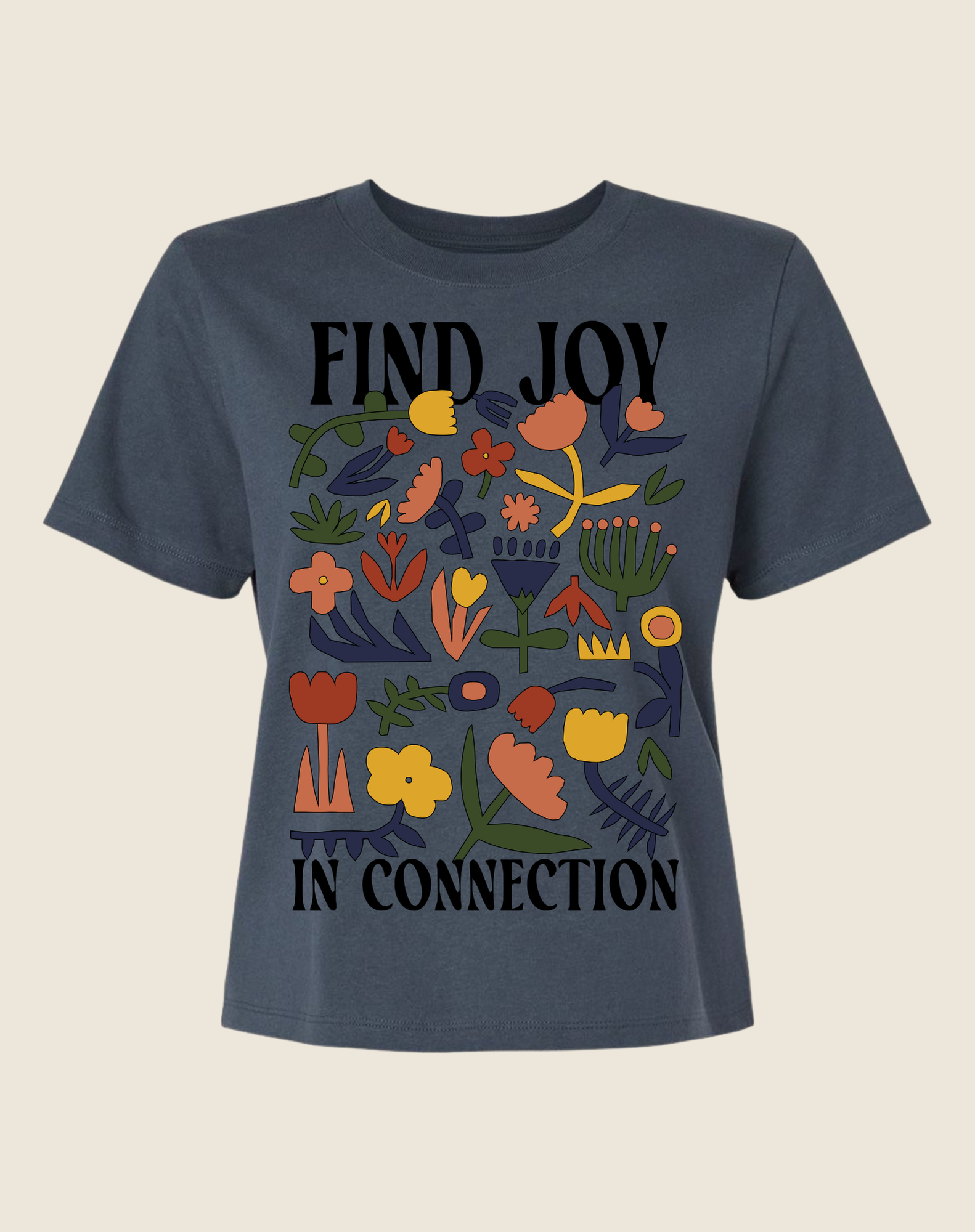 Navy blue t-shirt with colorful floral design and text 'FIND JOY IN CONNECTION' on a beige background