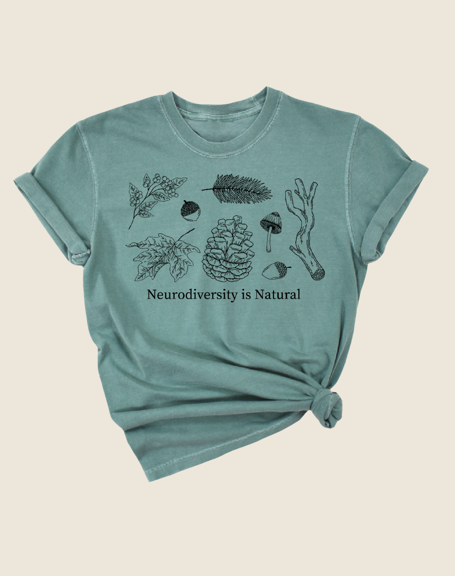 A green t-shirt with illustrations of leaves and pine cones and the text 'Neurodiversity is Natural'.