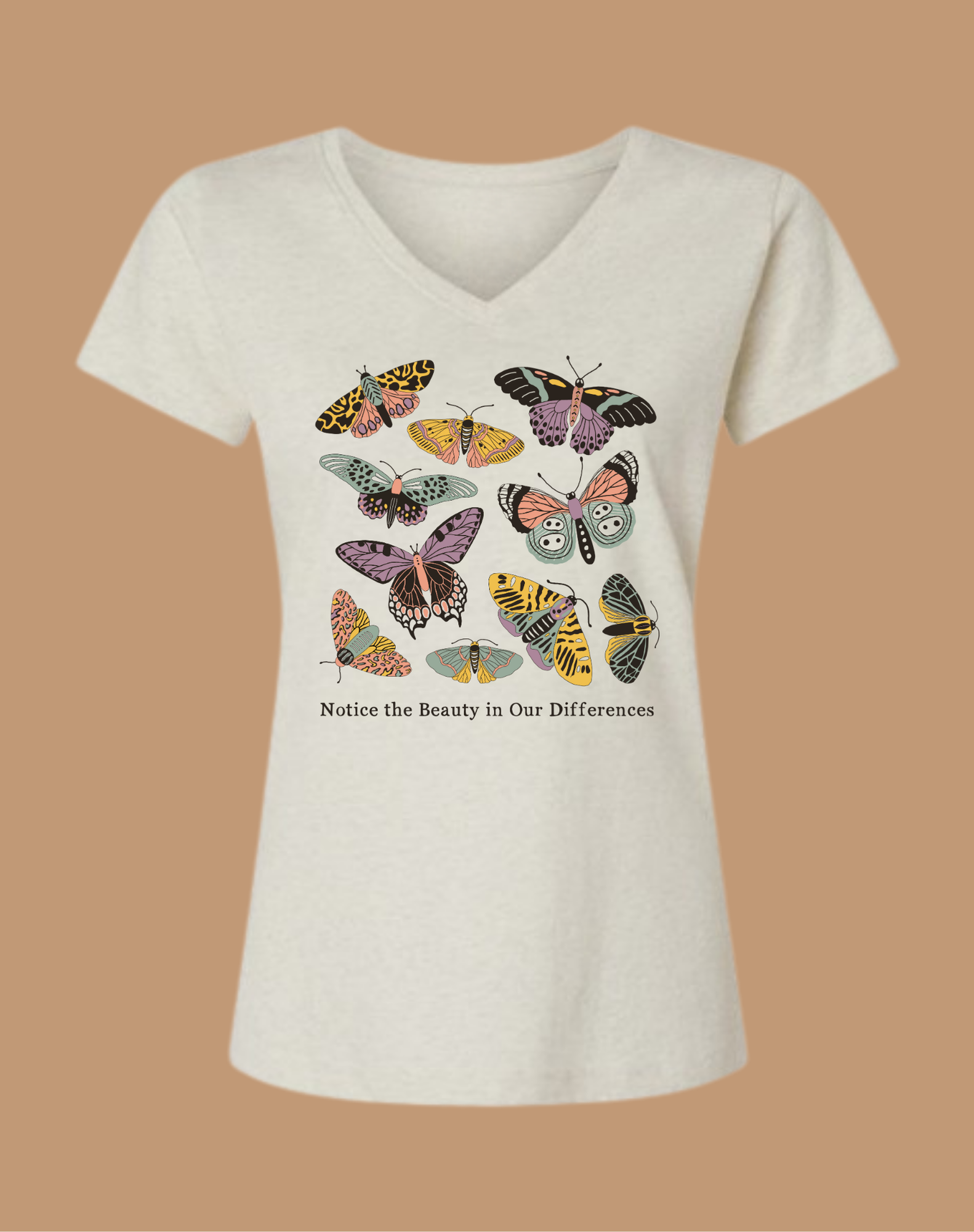 White t-shirt with colorful butterfly design and text on a beige background