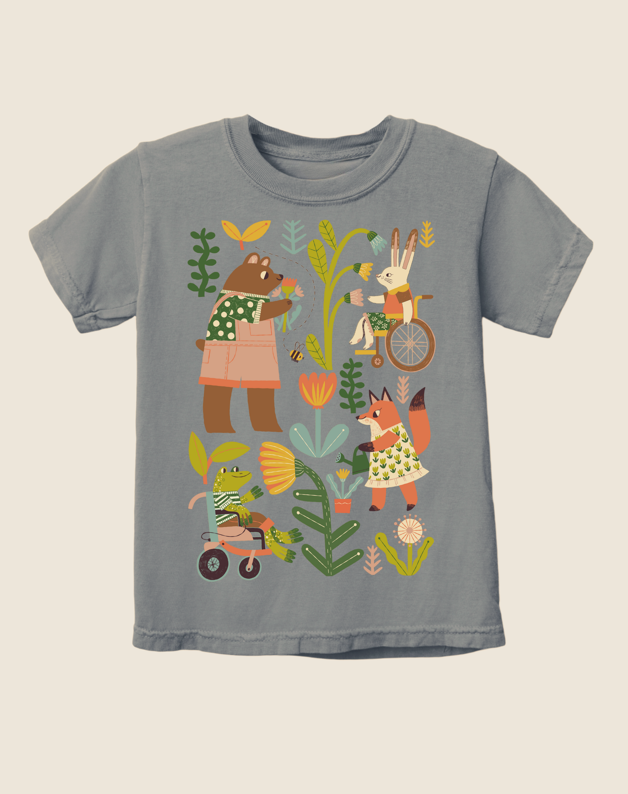 Children's gray t-shirt with colorful illustrations of various characters, including an octopus, a bear, a rabbit, and a wheelchair user, along with plants and a bicycle.