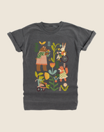 A gray-colored t-shirt featuring a colorful illustration of various characters, including a child in a wheelchair, surrounded by plants and animals.