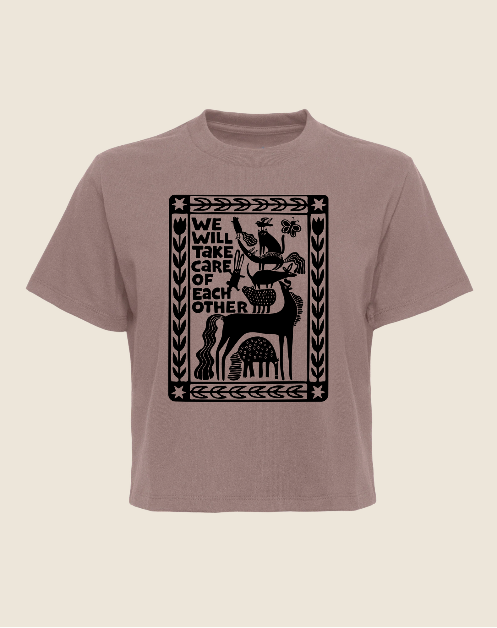 Brown t-shirt with black graphic design and text on a beige background