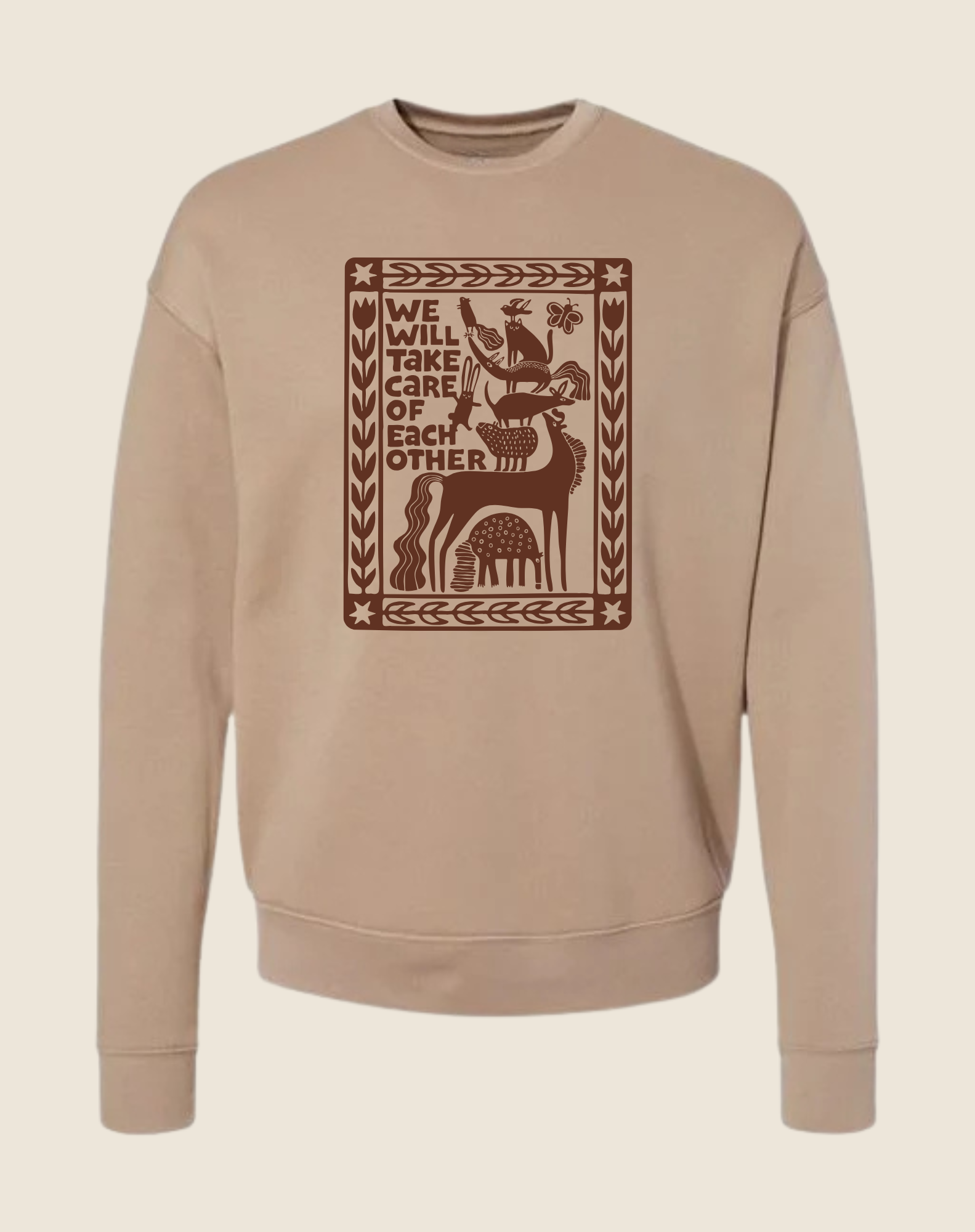 Beige sweatshirt with brown graphic design on a beige background